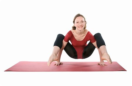 Woman exercising on a mat over white background Stock Photo - Budget Royalty-Free & Subscription, Code: 400-04822270