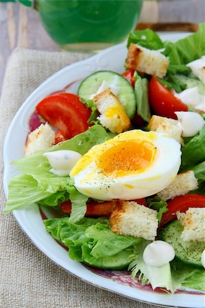 salad with fresh vegetables, tomatoes and eggs on a plate Stock Photo - Budget Royalty-Free & Subscription, Code: 400-04822336