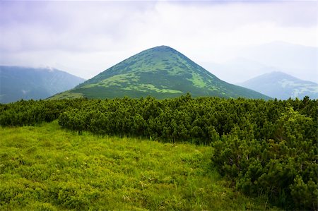 simsearch:400-06925688,k - Mountains landscape with clouds and blue sky Photographie de stock - Aubaine LD & Abonnement, Code: 400-04822667