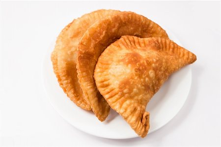 simsearch:400-04822787,k - Cheese empanada, meat empanada or chicken empanada on a white plate.   Empanada (meat pie) - traditional snack originally from Spain. Stock Photo - Budget Royalty-Free & Subscription, Code: 400-04822787