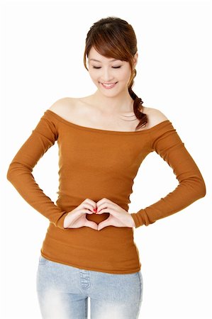 Smiling woman make heart shape on her belly. Stock Photo - Budget Royalty-Free & Subscription, Code: 400-04823406