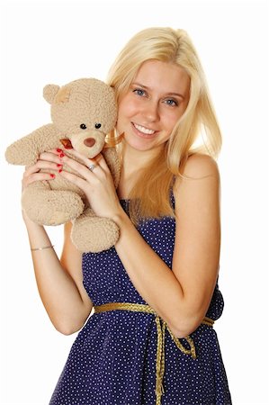 sunny_baby (artist) - Young attractive woman holding in the arms of Teddy.  Isolated on white Foto de stock - Royalty-Free Super Valor e Assinatura, Número: 400-04823412