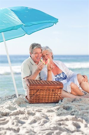 Elderly couple picniking on the beach Stock Photo - Budget Royalty-Free & Subscription, Code: 400-04834457