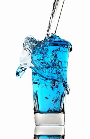 fresh spring drinking water - drinking water pouring from pvc bottle on blue Stock Photo - Budget Royalty-Free & Subscription, Code: 400-04834628