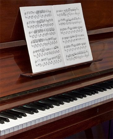 symphony audience - A close up of an old piano with a note-sheet Stock Photo - Budget Royalty-Free & Subscription, Code: 400-04834789