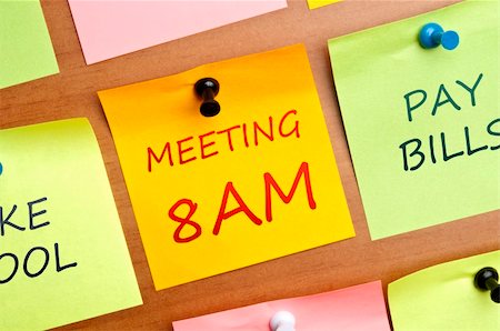 simsearch:400-04835143,k - Meeting 8AM post it on wooden wall Stock Photo - Budget Royalty-Free & Subscription, Code: 400-04835154