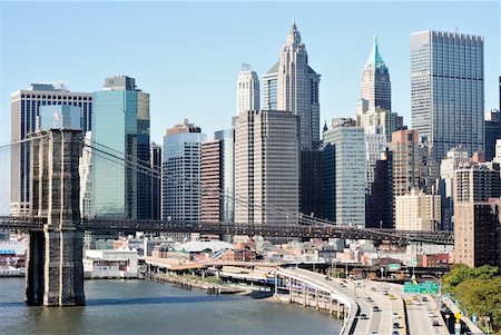 Dramatic Skyline of Manhattan Island in New York CIty with the brooklyn bridge. Stock Photo - Budget Royalty-Free & Subscription, Code: 400-04835177