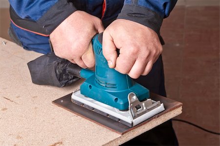 simsearch:400-04856931,k - A man working with electrical sanding machine, close up on tool, hands and sparks, real situation picture Photographie de stock - Aubaine LD & Abonnement, Code: 400-04835218