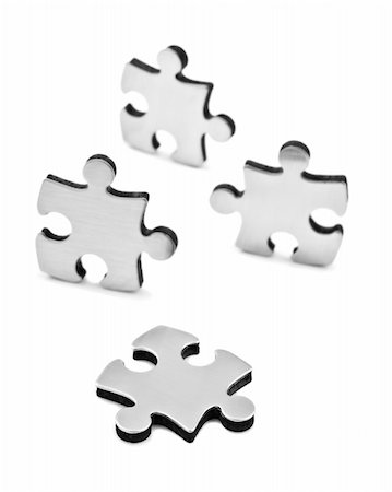 simsearch:700-00561055,k - Stainless steel puzzle pieces on white background with space for text Stock Photo - Budget Royalty-Free & Subscription, Code: 400-04835306