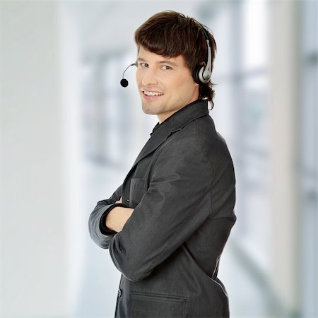 Charming customer service representative with headset on Stock Photo - Budget Royalty-Free & Subscription, Code: 400-04835652