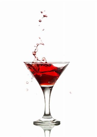 simsearch:400-06911038,k - red martini cocktail splashing into glass on white background Stock Photo - Budget Royalty-Free & Subscription, Code: 400-04836982
