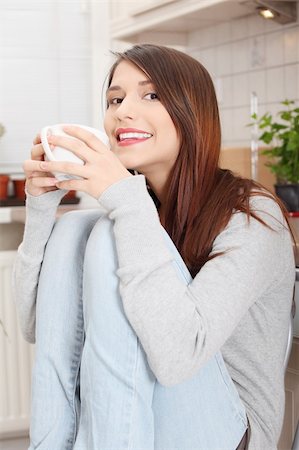 simsearch:400-04335902,k - Young beautiful woman having coffee or tea in the kitchen Stock Photo - Budget Royalty-Free & Subscription, Code: 400-04837085