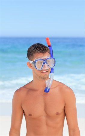 smile as mask for boy - Man with his mask at the beach Stock Photo - Budget Royalty-Free & Subscription, Code: 400-04837465