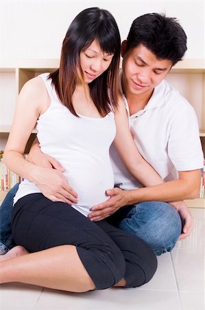 Husband and 8 months pregnant wife. Stock Photo - Budget Royalty-Free & Subscription, Code: 400-04837615