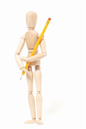 wooden puppet holding pencil on white background Stock Photo - Budget Royalty-Free & Subscription, Code: 400-04837702