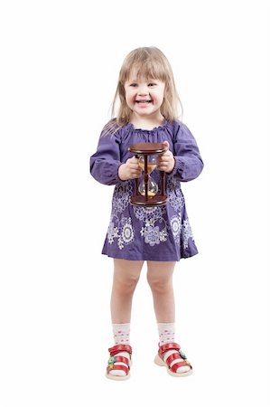 Young girl stand with hourglass Fotografie stock - Microstock e Abbonamento, Codice: 400-04837765