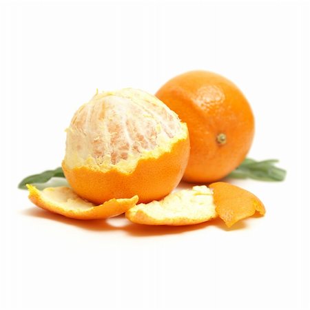 simsearch:400-07613620,k - A couple oranges are isolated on white with one half peeled to enjoy its juicy fruit on the inside. Stockbilder - Microstock & Abonnement, Bildnummer: 400-04837812