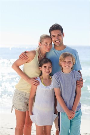 Joyful family at the beach Stock Photo - Budget Royalty-Free & Subscription, Code: 400-04837937