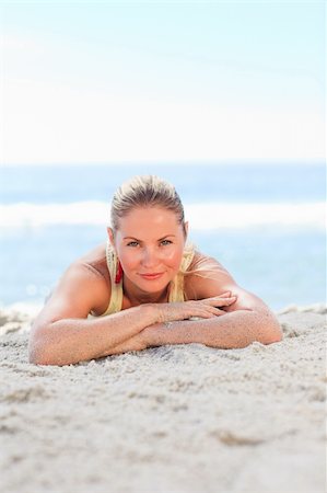 simsearch:400-04457689,k - A woman sunbathing at the beach Stock Photo - Budget Royalty-Free & Subscription, Code: 400-04837933