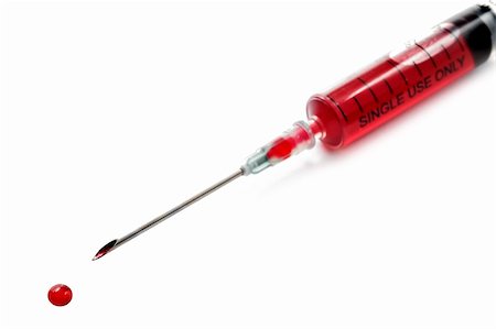 Syringe filled with blood on white Fotografie stock - Microstock e Abbonamento, Codice: 400-04838038