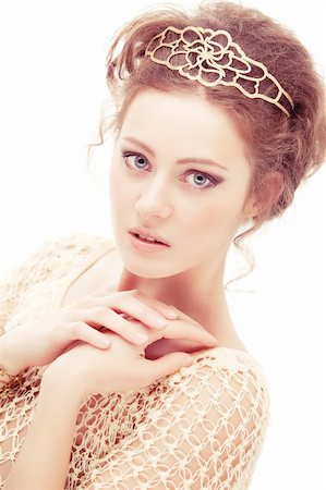 diadème - Young shy woman in a diadem of gold, isolated on white background. Stock Photo - Budget Royalty-Free & Subscription, Code: 400-04838192