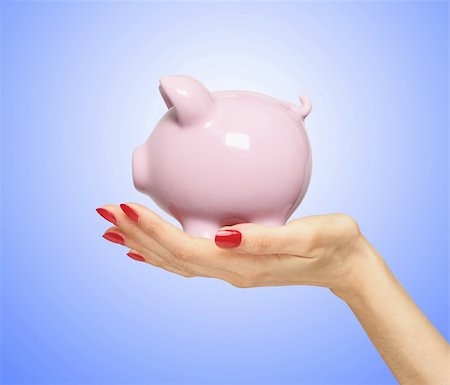 simsearch:400-04995456,k - piggy bank on woman hand over blue background Foto de stock - Super Valor sin royalties y Suscripción, Código: 400-04839136