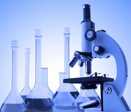 Laboratory metal microscope and test tubes with liquid toning in blue color Stock Photo - Budget Royalty-Free & Subscription, Code: 400-04839130