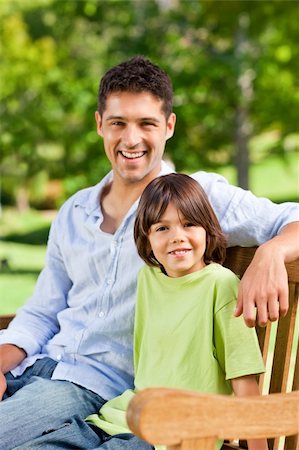 portrait of family on park bench - Son with his father on the bench Stock Photo - Budget Royalty-Free & Subscription, Code: 400-04839526