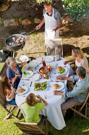 simsearch:400-04327229,k - Lovely family eating in the garden Stock Photo - Budget Royalty-Free & Subscription, Code: 400-04830000