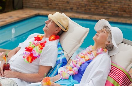 elderly woman in the pool - Retired couple sleeping beside the swimming pool Stock Photo - Budget Royalty-Free & Subscription, Code: 400-04830163