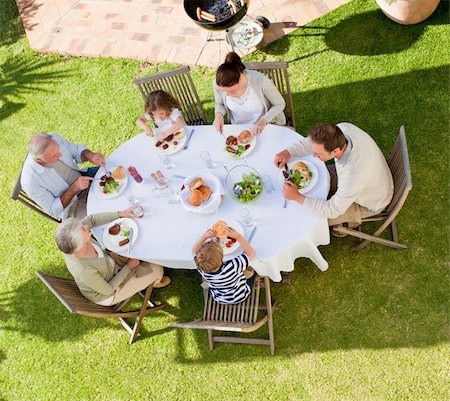 simsearch:400-04327229,k - Family eating in the garden Stock Photo - Budget Royalty-Free & Subscription, Code: 400-04830335