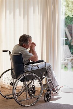Senior man in his wheelchair Stock Photo - Budget Royalty-Free & Subscription, Code: 400-04830638