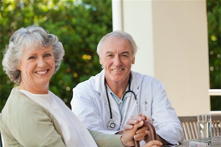 doctor pushing wheelchair - Senior doctor talking with his mature patient Stock Photo - Budget Royalty-Free & Subscription, Code: 400-04830736