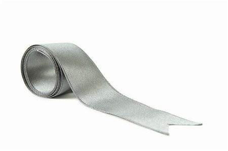 Silver satin ribbon isolated on a white background with a clipping path/part of ribbon series Photographie de stock - Aubaine LD & Abonnement, Code: 400-04830909