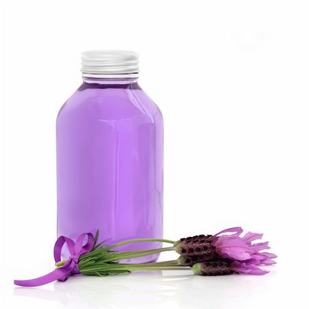 Lavender herb flower water in a glass bottle with flowers and lilac ribbon, isolated over white background. Stock Photo - Budget Royalty-Free & Subscription, Code: 400-04831034