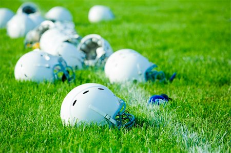 Football helmets on the field during school practice break Stock Photo - Budget Royalty-Free & Subscription, Code: 400-04831108
