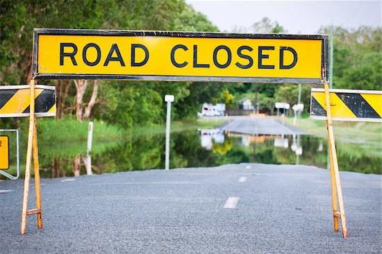 A road closed sign on a flooded road in Queensland, Australia Stock Photo - Royalty-Free, Artist: Jaykayl, Image code: 400-04831129