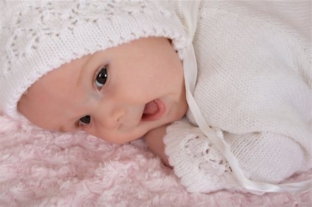 Beautiful two month old baby girl wearing a knitted outfit Stock Photo - Budget Royalty-Free & Subscription, Code: 400-04831136