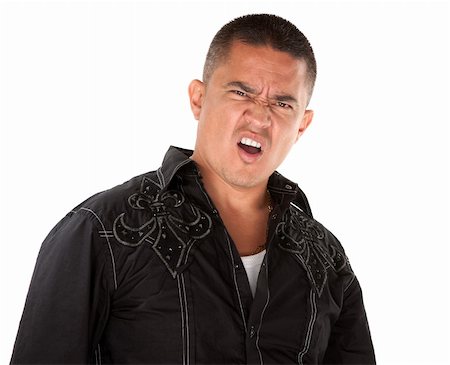 Annoyed middle-aged Hispanic man on white background Stock Photo - Budget Royalty-Free & Subscription, Code: 400-04831177