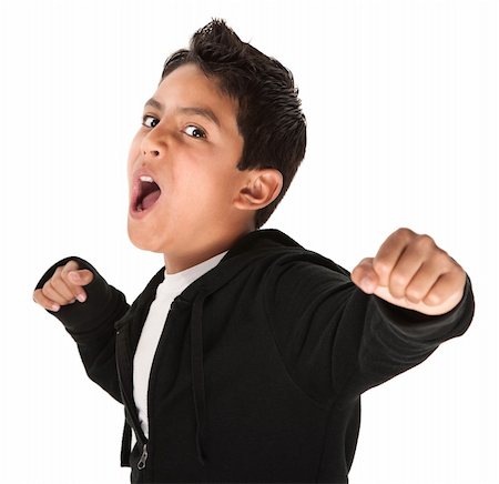 Young Hispanic kid showing fist and ready to fight on white background Foto de stock - Super Valor sin royalties y Suscripción, Código: 400-04831170