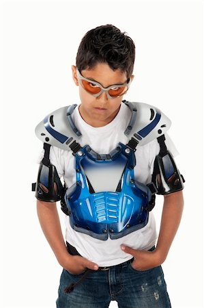 Serious Latino youngster in motorcross gear and hands in pockets Photographie de stock - Aubaine LD & Abonnement, Code: 400-04831181
