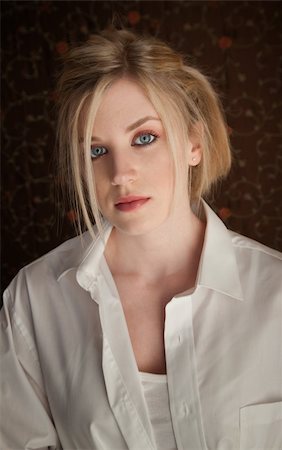 sad and quiet woman - Serious young blonde girl in a white shirt Stock Photo - Budget Royalty-Free & Subscription, Code: 400-04831200