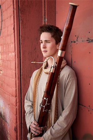 Young Caucasian man outside holds a bassoon Stock Photo - Budget Royalty-Free & Subscription, Code: 400-04831302