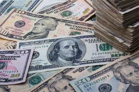 Variety of American money laid out under a stack of cash. Stock Photo - Budget Royalty-Free & Subscription, Code: 400-04831808