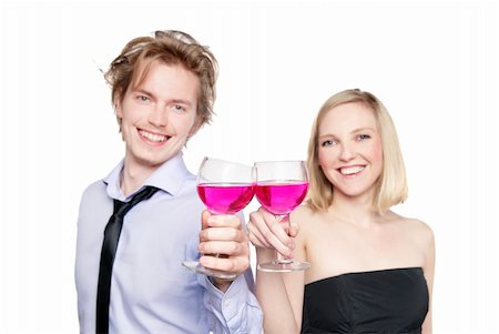 Young couple toasting with pink drink. Selective Focus. Studio photo, isolated. Stock Photo - Budget Royalty-Free & Subscription, Code: 400-04831821