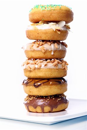 simsearch:400-04178778,k - Colorful and tasty donuts on white background Foto de stock - Super Valor sin royalties y Suscripción, Código: 400-04832184