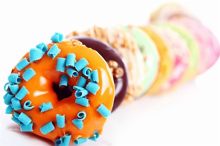 simsearch:400-06524508,k - Colorful and tasty donuts on white background Stock Photo - Budget Royalty-Free & Subscription, Code: 400-04832190