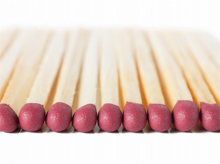 simsearch:400-04758178,k - Macro view of row of matches isolated over white Stock Photo - Budget Royalty-Free & Subscription, Code: 400-04832549