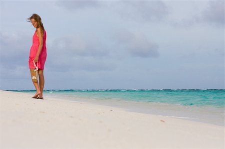 Girl goes for a walk on the coast of tropical island Stock Photo - Budget Royalty-Free & Subscription, Code: 400-04832763