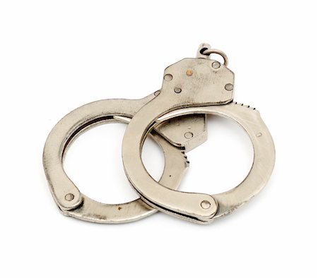 simsearch:400-05300234,k - steel metallic handcuffs (manacles) isolated on white background Fotografie stock - Microstock e Abbonamento, Codice: 400-04832790